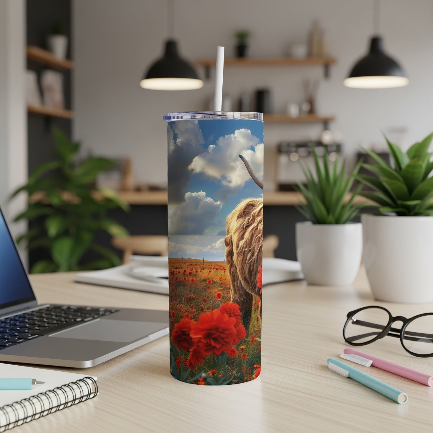 Highland cow in a field of red poppies on a patterned tumbler.