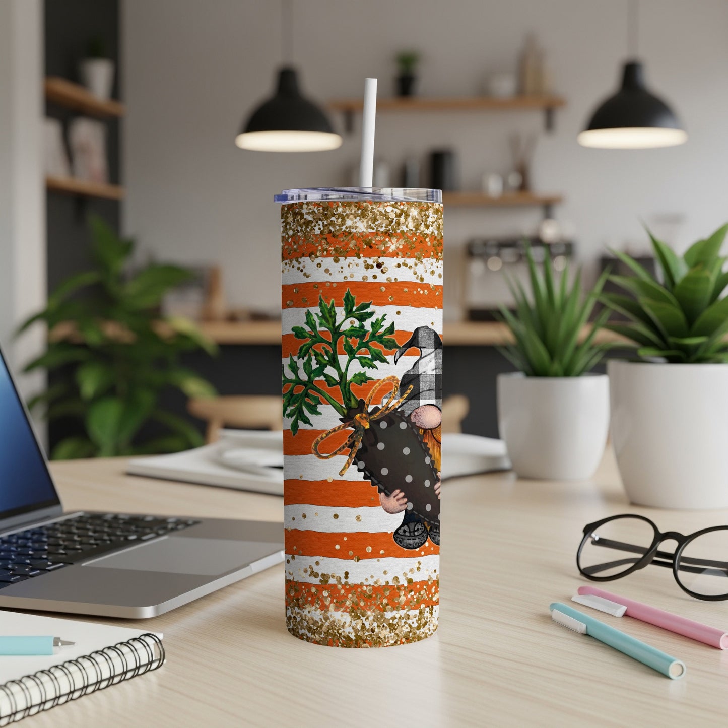 Orange striped tumbler with a gnome, carrot, and glitter accents.