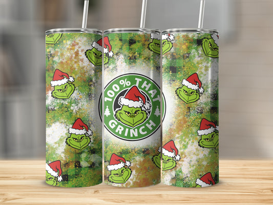 Grinch tumbler with "100% That Grinch" text and green plaid pattern.