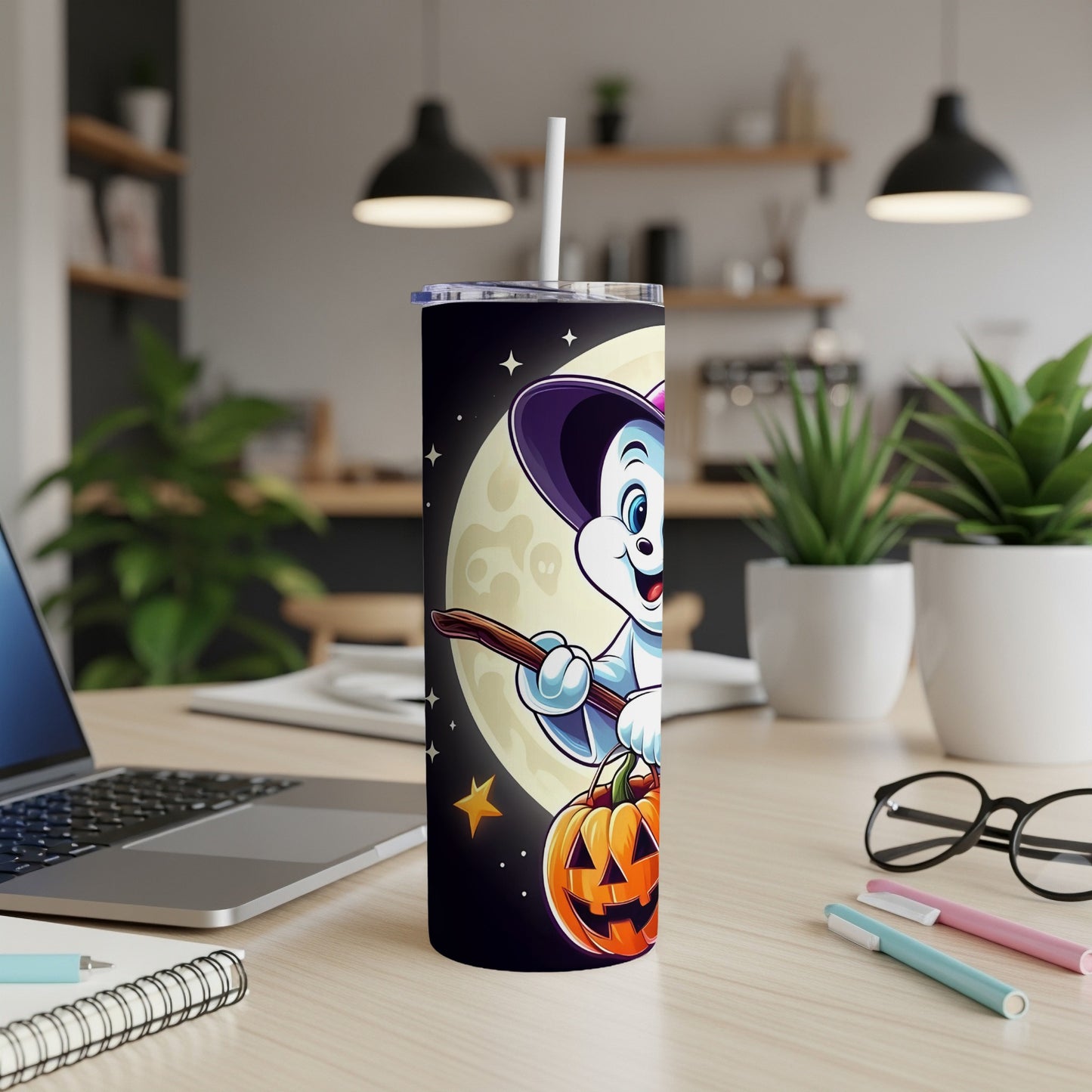 Halloween tumbler with a cartoon character riding a broom and holding a pumpkin.