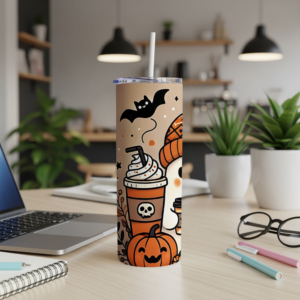 Halloween tumbler with pumpkin, ghost, bat, and coffee cup graphics.
