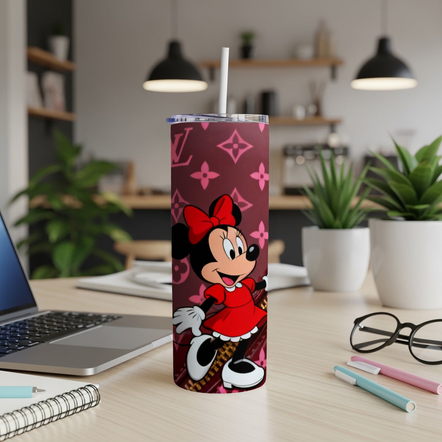 Minnie Mouse on a pink monogrammed tumbler with a straw.