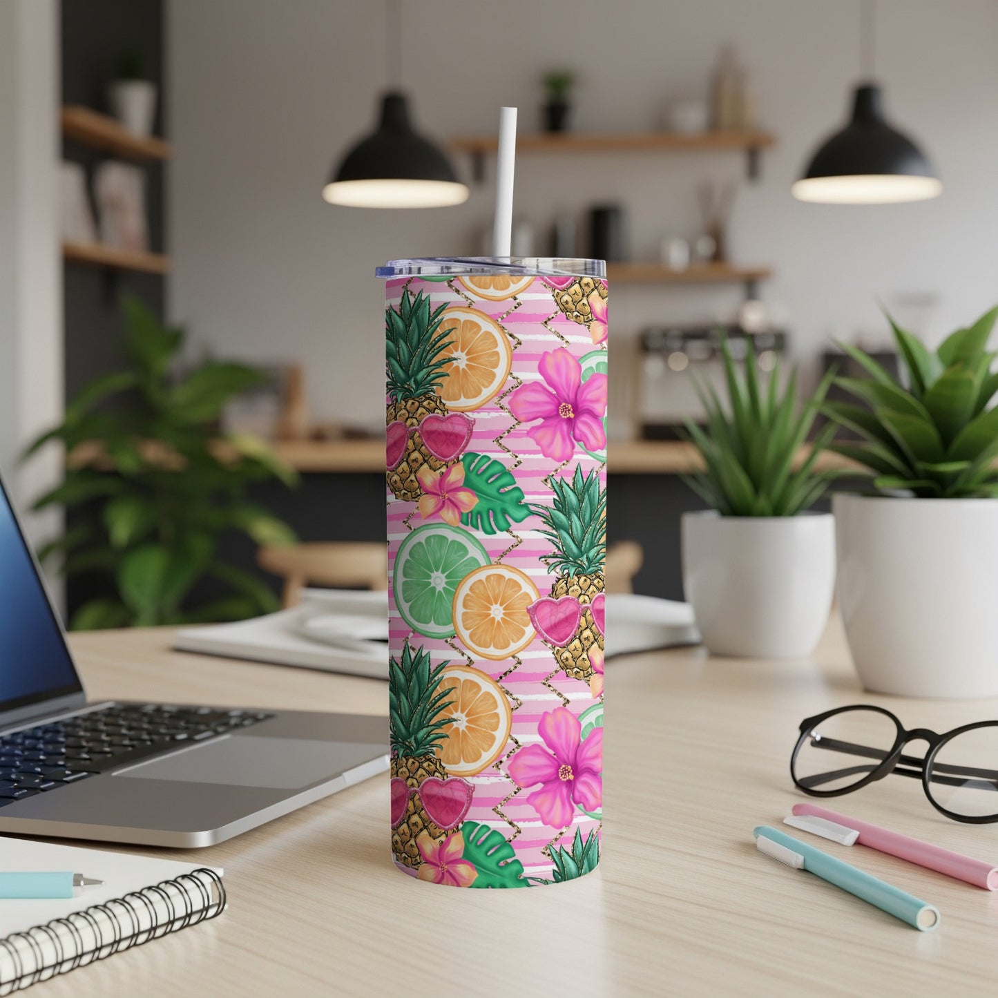 Striped tumbler with fruit, pineapple, and floral pattern, includes straw.