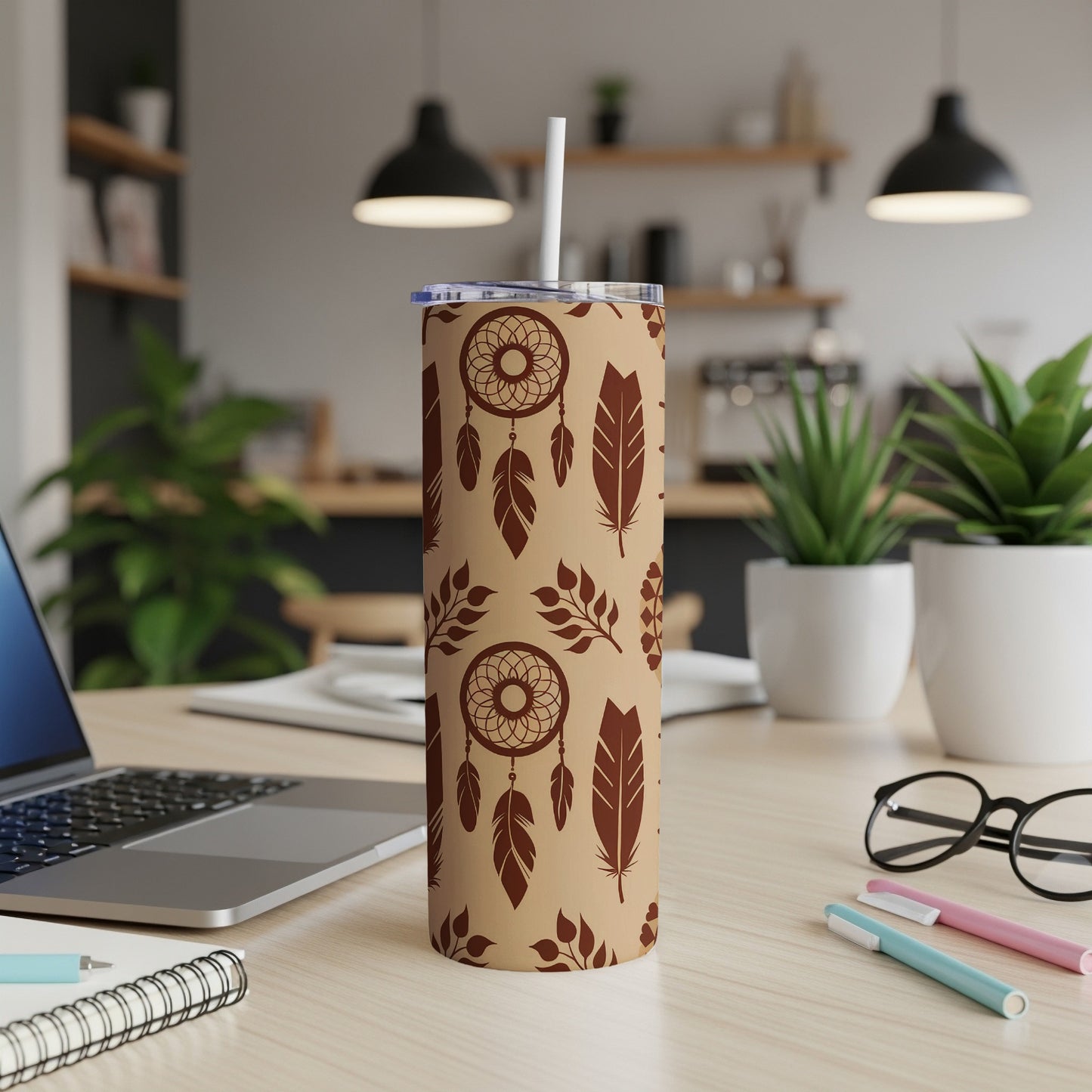 Brown tumbler with dream catcher and feather pattern.