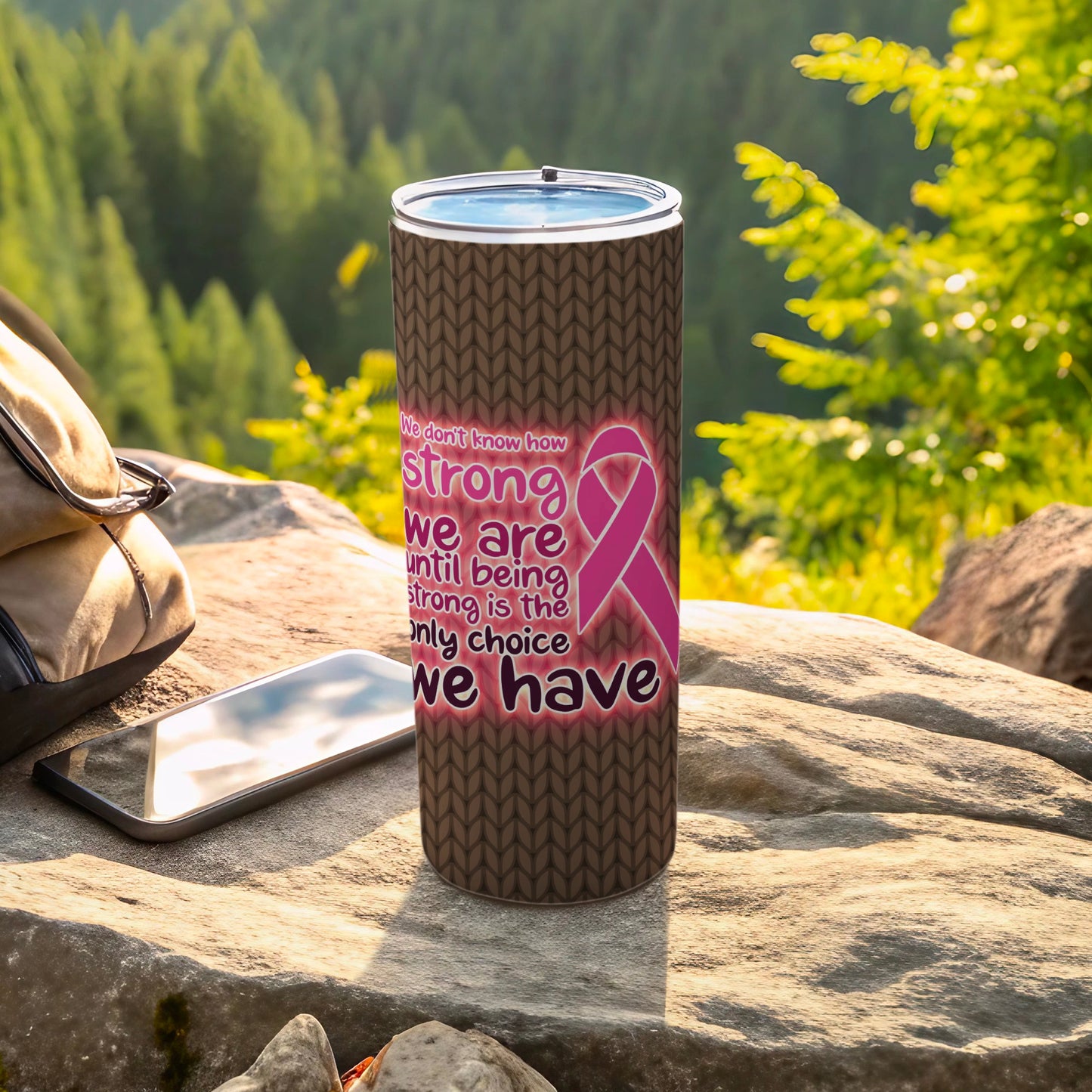 Tumbler with "strong is the only choice we have" text and pink ribbon design.