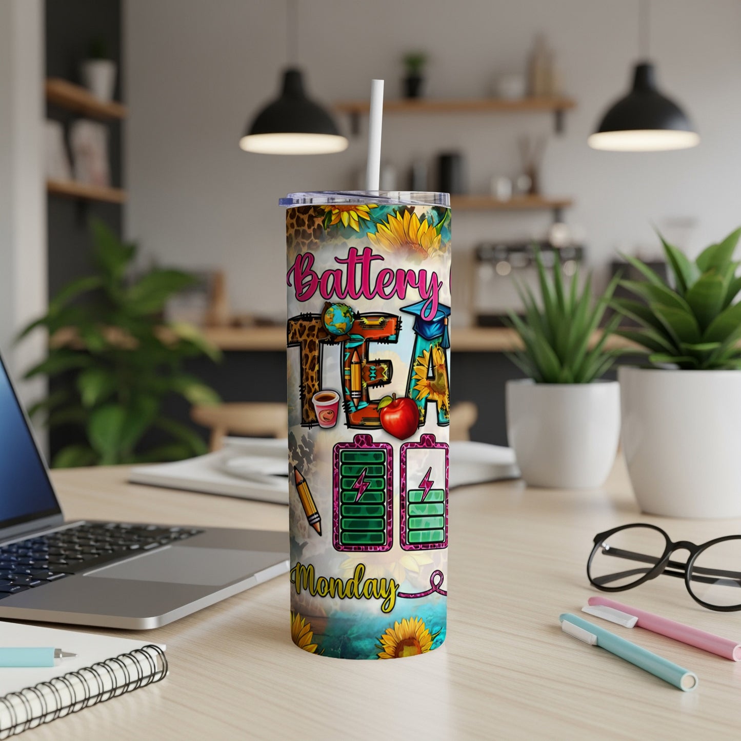 "TEACH" text design on a tumbler with pencils, apples, and sunflowers.