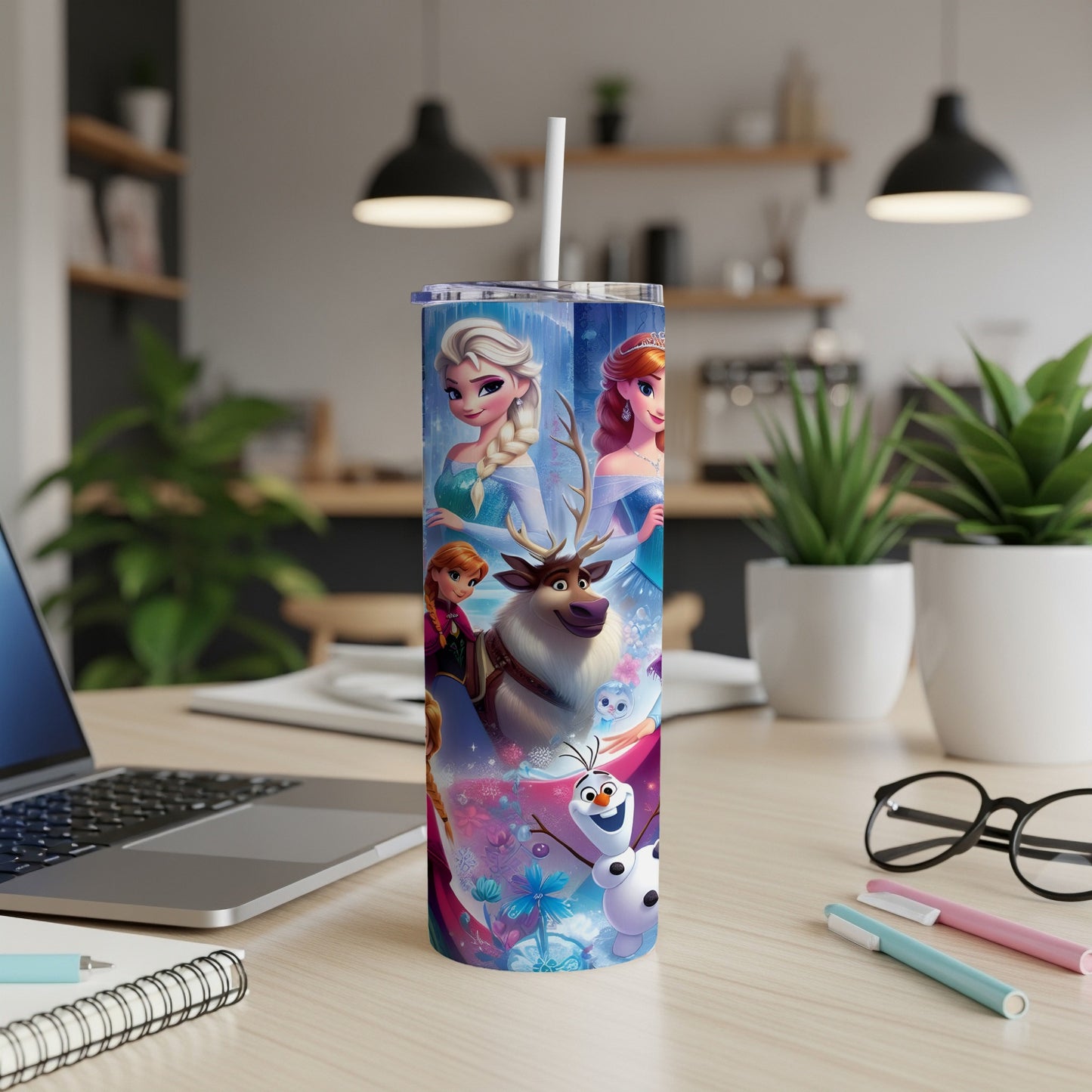 Frozen characters Olaf, Sven, Anna, and Elsa on a blue and pink floral tumbler.