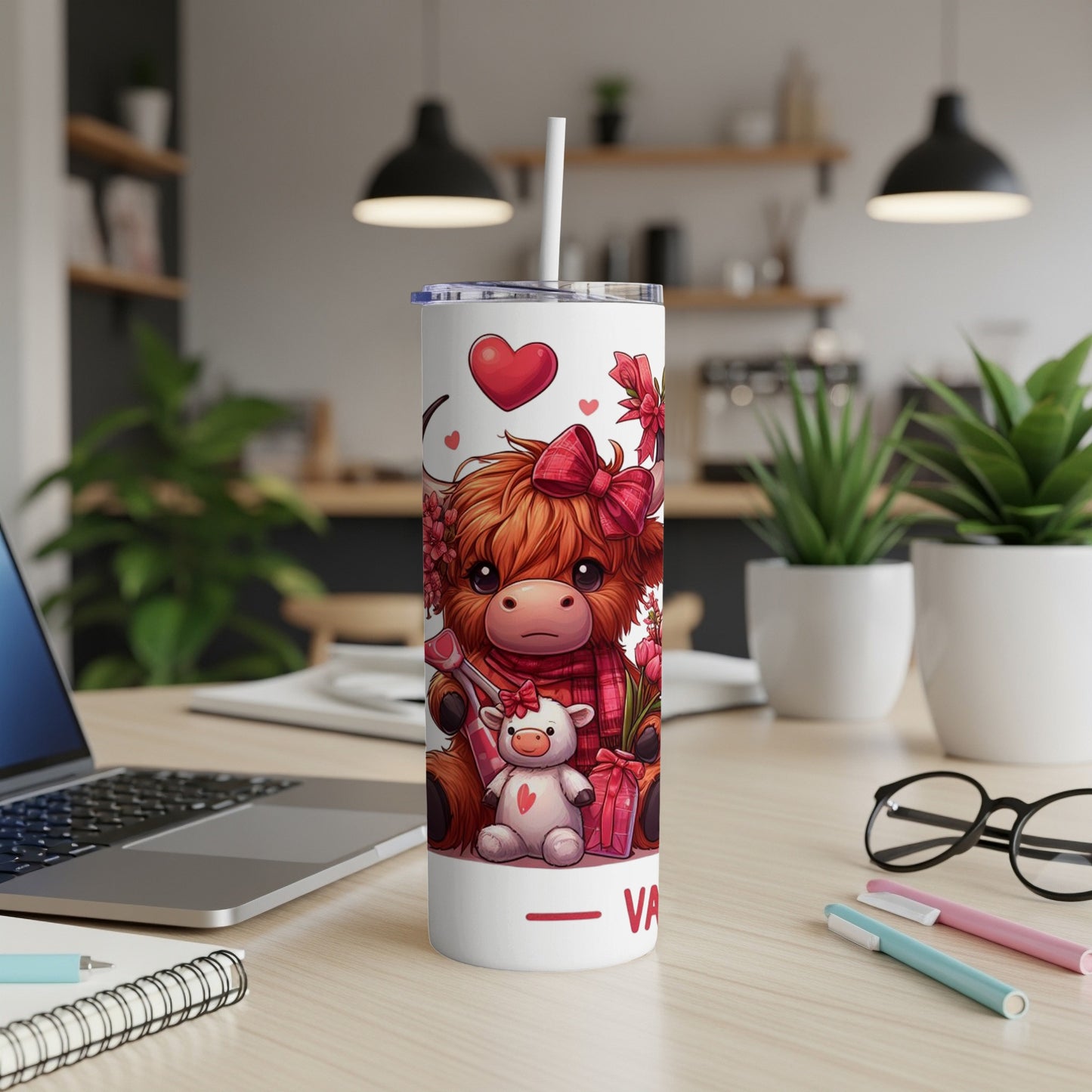White tumbler with cute cartoon Highland cow and teddy bear design.