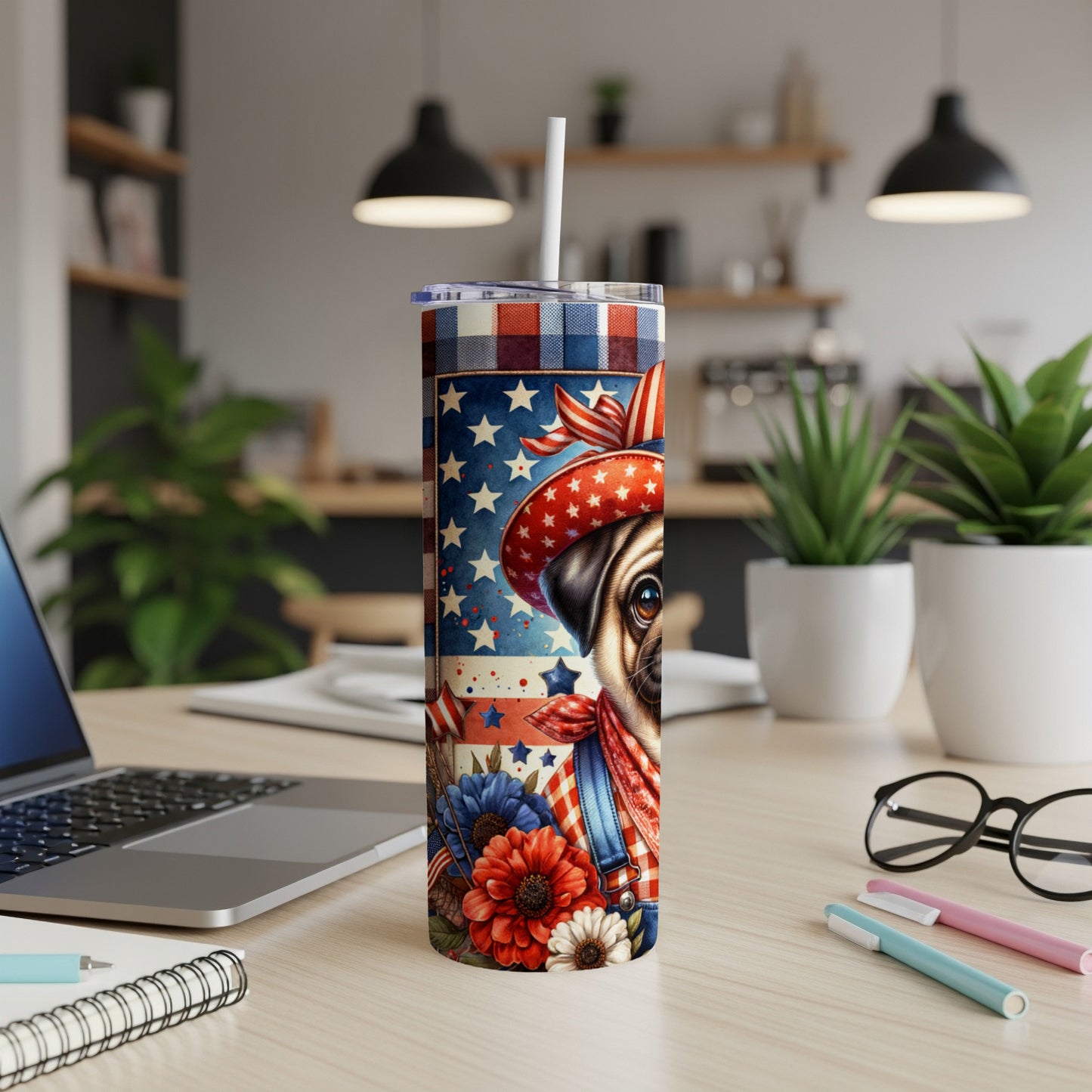 Pug wearing a patriotic bandana and hat, surrounded by flowers, on a tumbler.