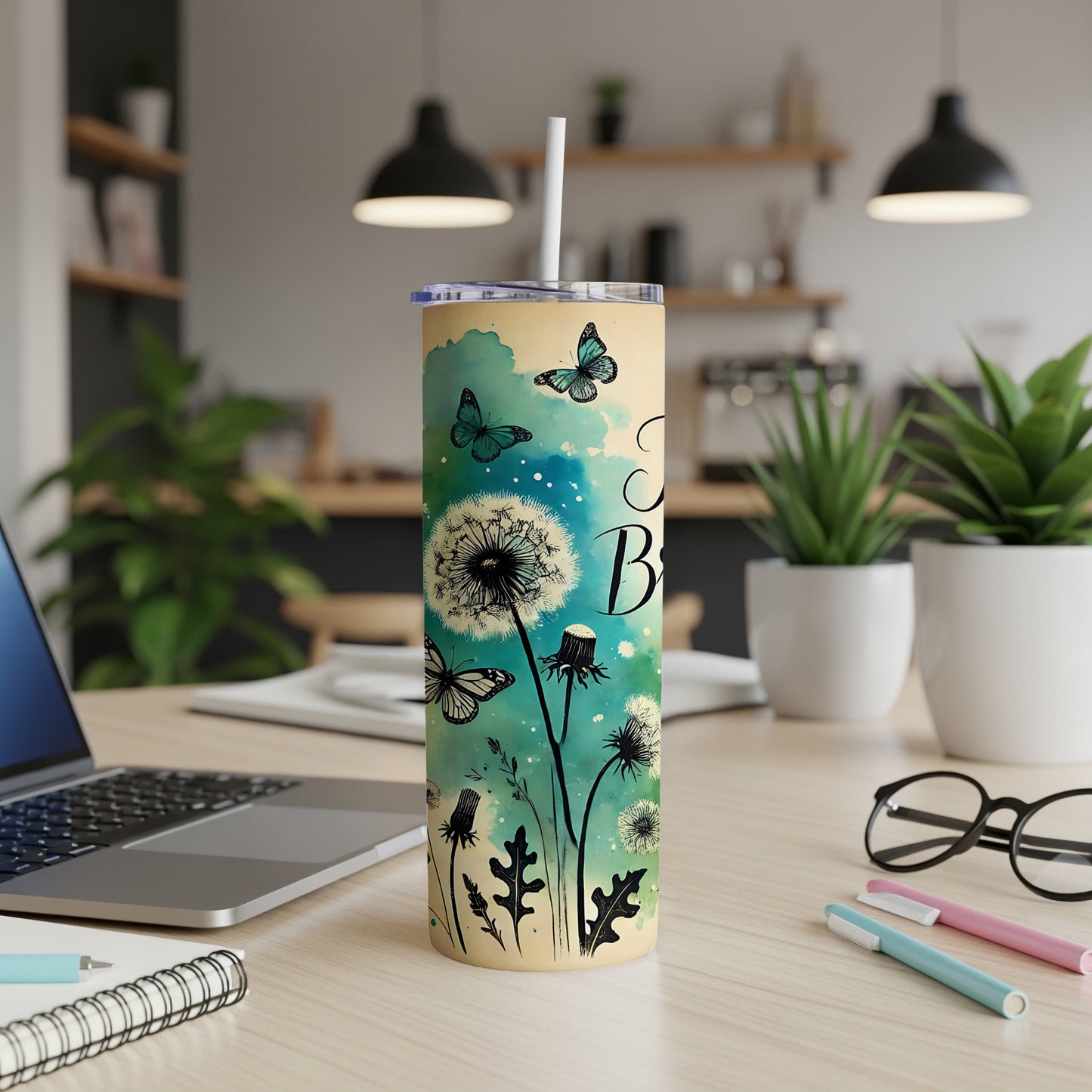 Yellow tumbler with dandelions and butterflies, "Be Kind" text.
