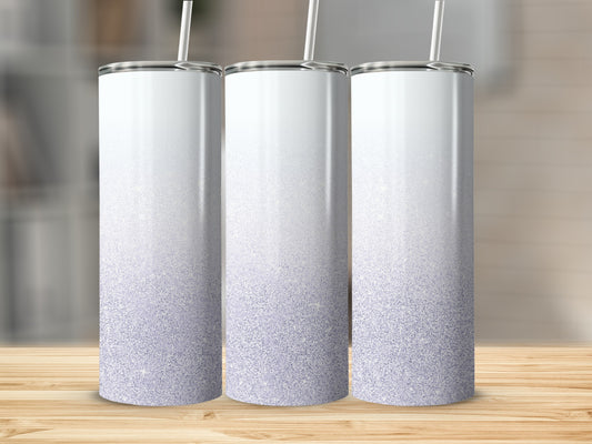 Three white tumblers with a purple glitter gradient on a wooden surface.