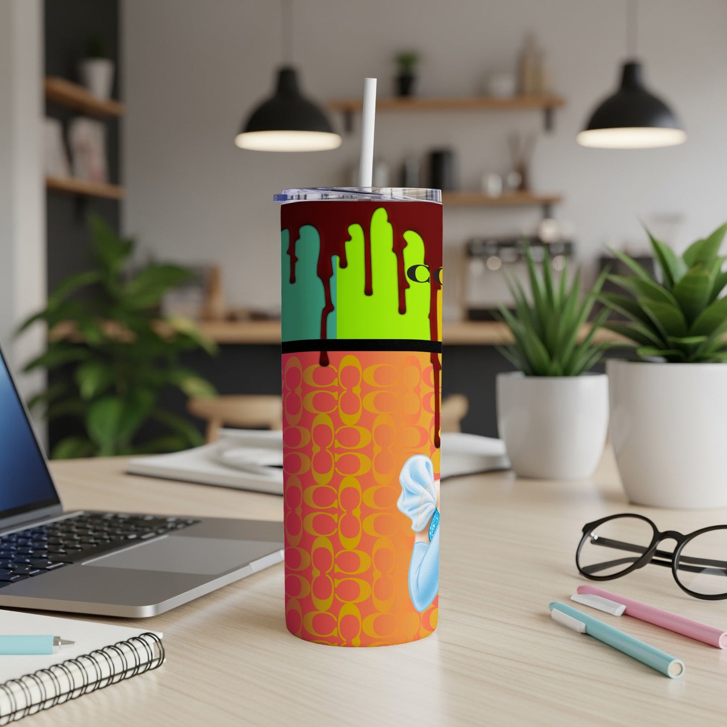 Tumbler with "C" pattern, dripping paint, and character.