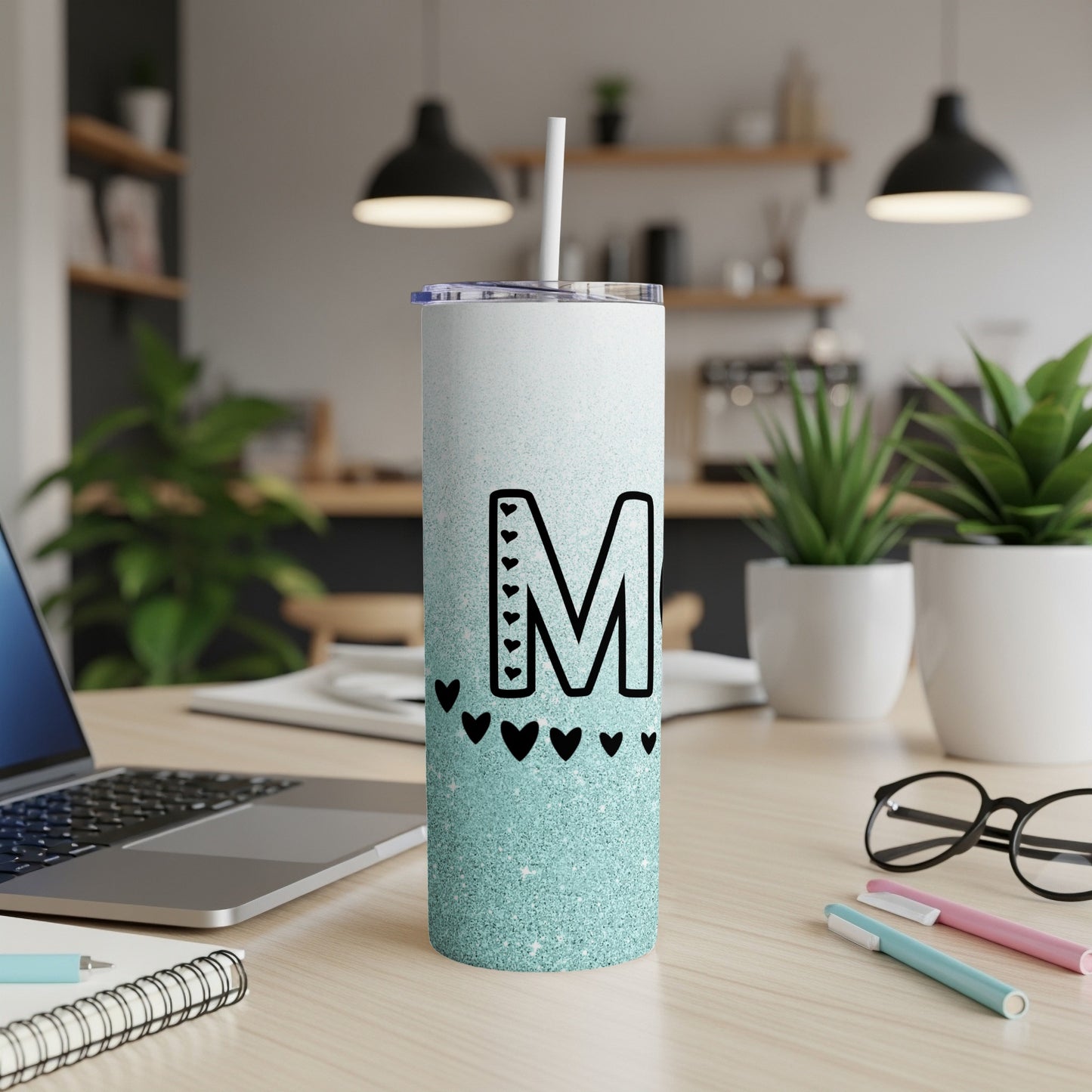 Glittery mint tumbler with letter M and heart accents.