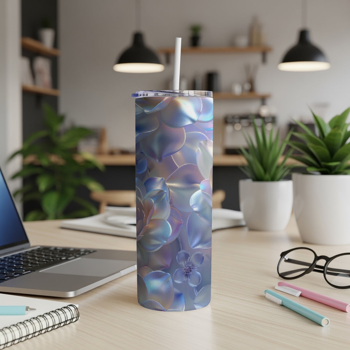 Iridescent succulent floral pattern on a stainless steel tumbler with straw.