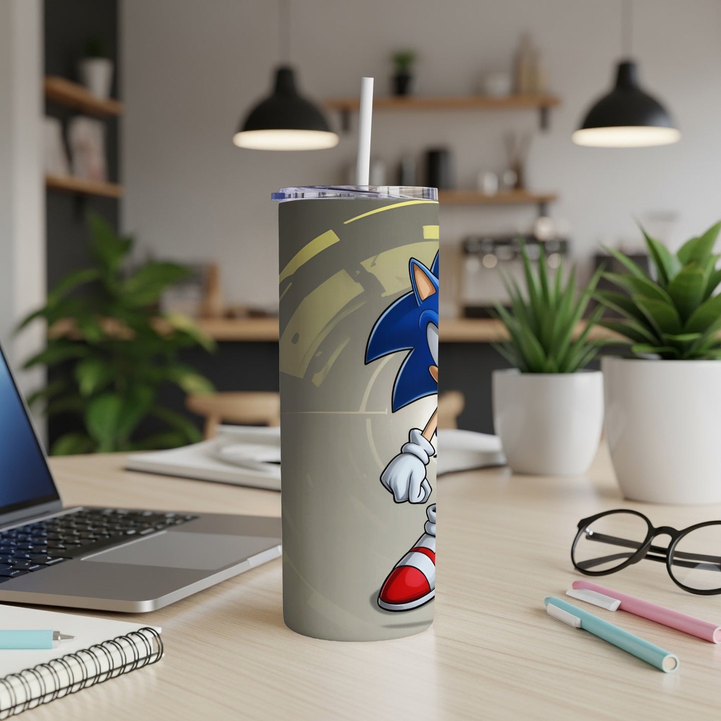 Sonic the Hedgehog on a grey tumbler with a white straw.