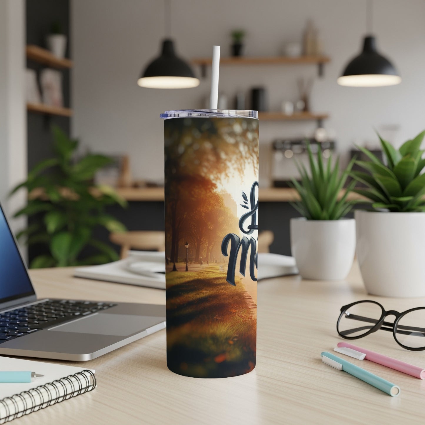 Tumbler with "Life is Good" text against a blurred park sunset background.