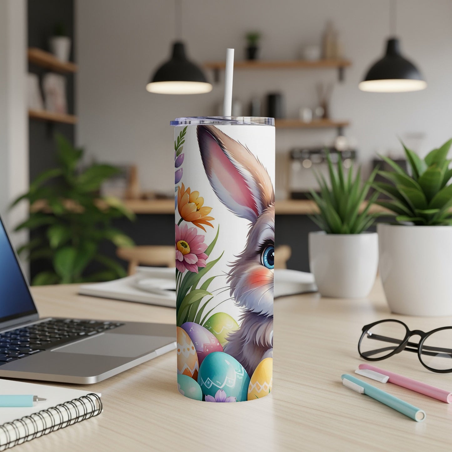 Easter bunny with colorful eggs and flowers on a white tumbler.