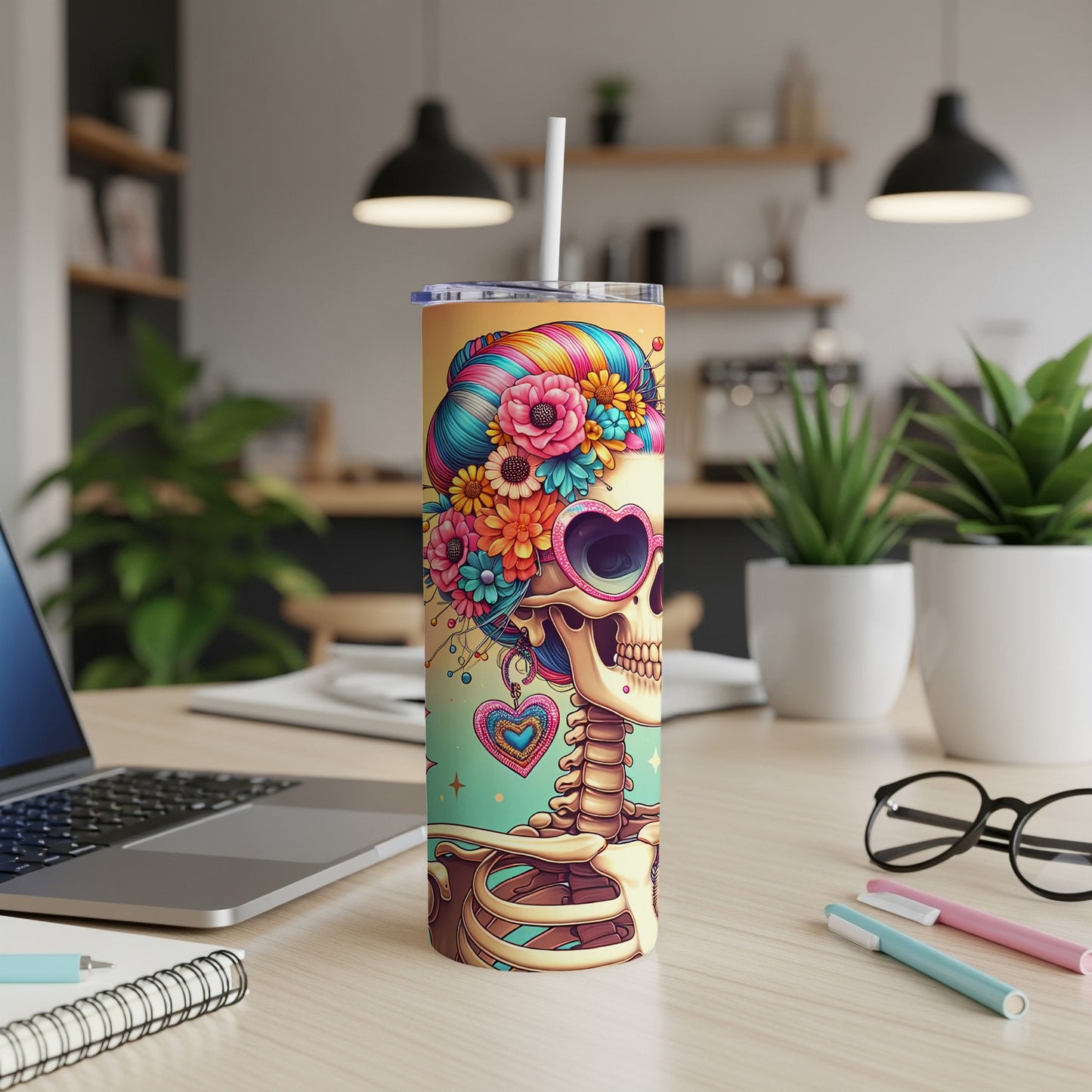 Skeleton with heart sunglasses and floral crown on a colorful tumbler.