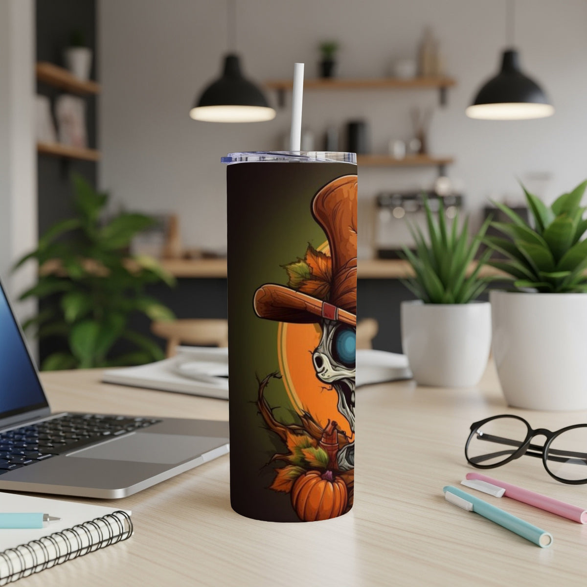 Halloween tumbler with skeleton, top hat, and pumpkins.