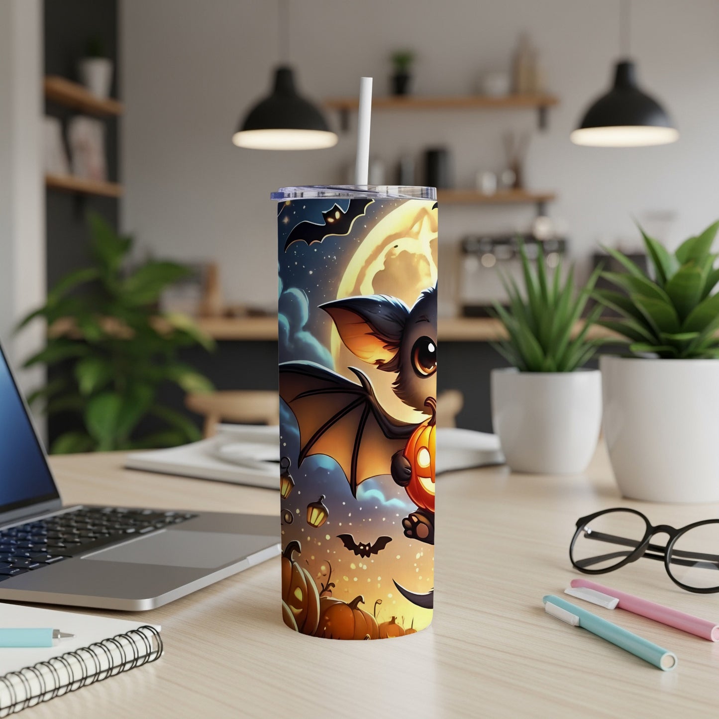 Halloween tumbler with a cartoon bat holding a pumpkin under a full moon.