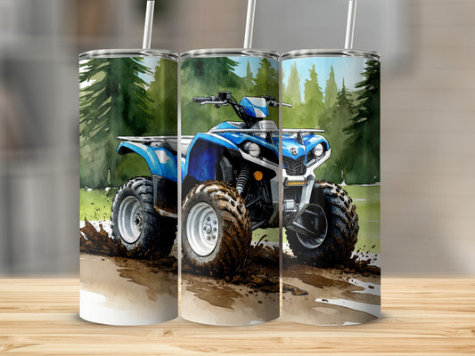 Blue ATV splashing through mud and water in a forest.
