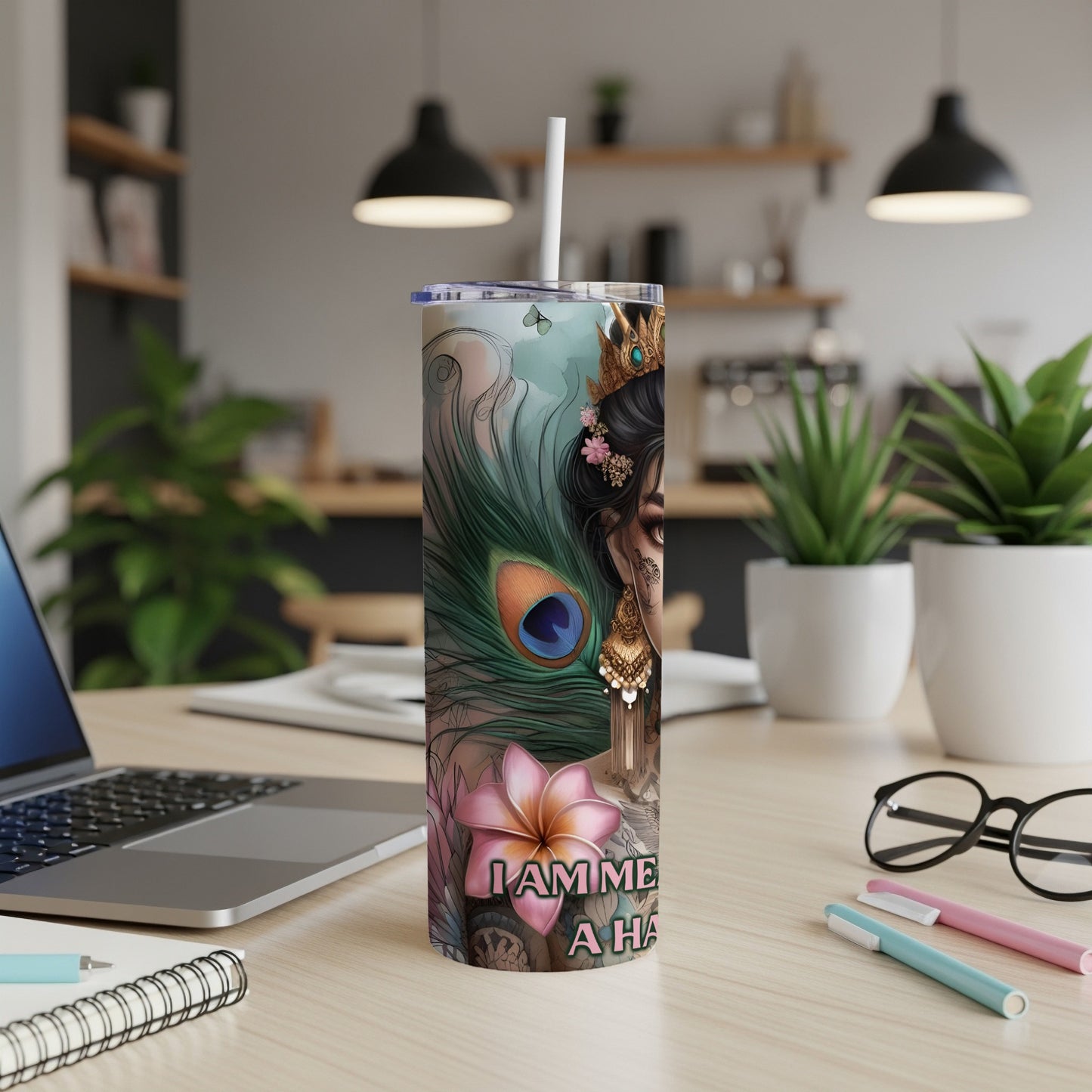 Tumbler with a woman and peacock feather design, "I am me" text.