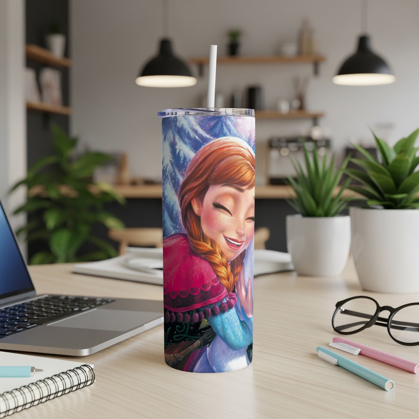 Anna from Frozen smiles on a blue and pink insulated tumbler with a straw.