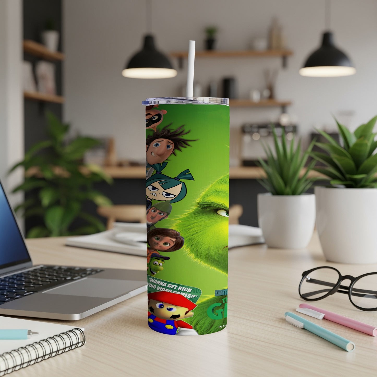 The Grinch and Mario characters on a green tumbler with a white straw.