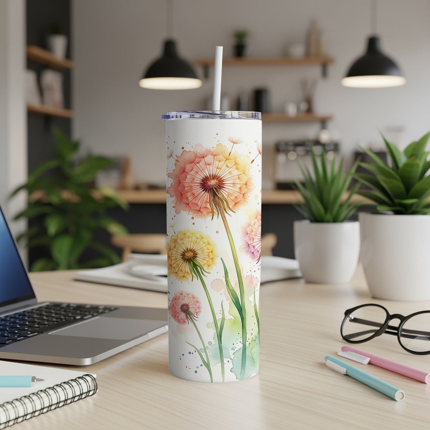 Watercolor dandelions on a white tumbler with a straw.