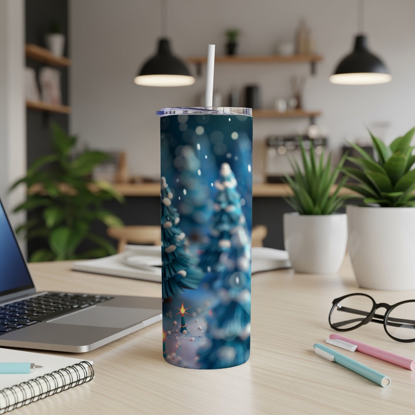Blue and white speckled tumbler with blurry Christmas trees and bokeh lights.