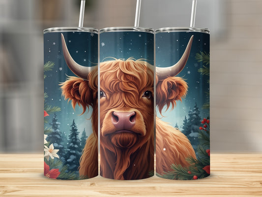 Highland cow with starry sky, snow, and pine trees on a tumbler.