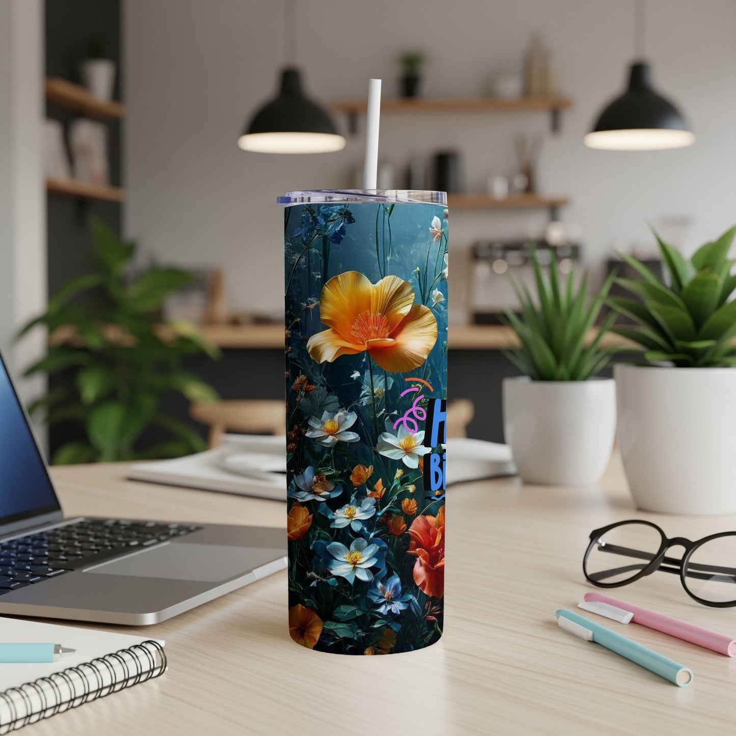Tall tumbler with "Happy Birthday" text and colorful floral pattern.