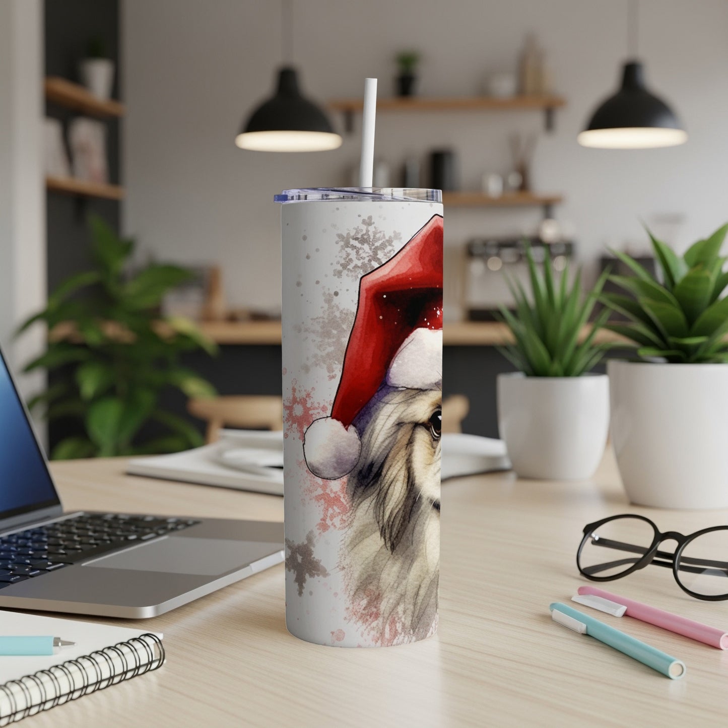 White tumbler with a painted dog wearing a Santa hat.