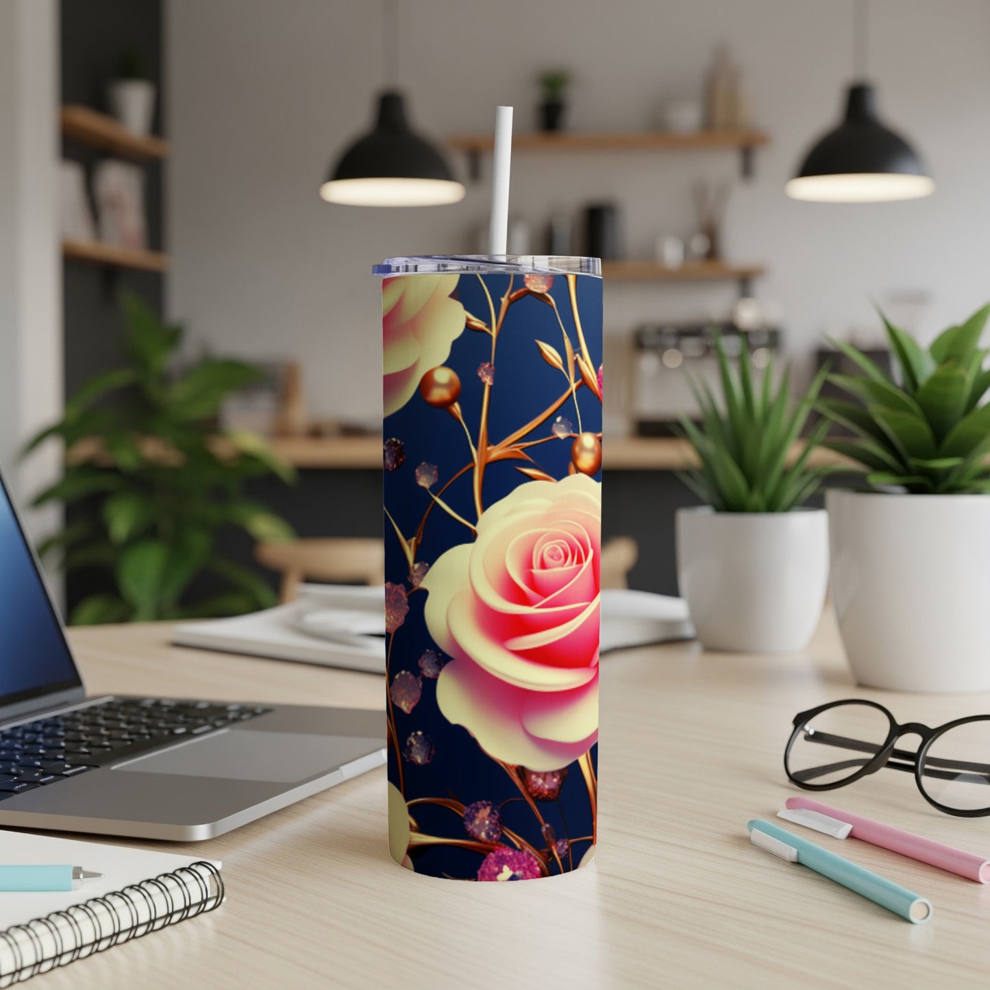 Pink and yellow roses on a navy blue tumbler with straw.