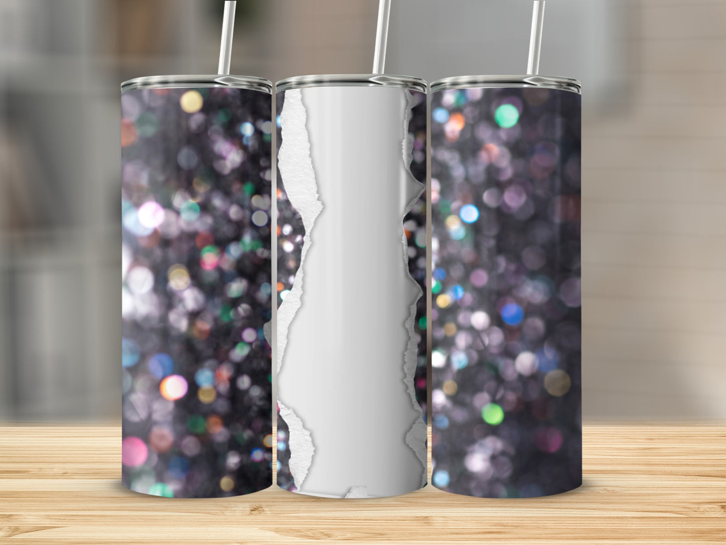 Three glitter tumblers with ripped paper effect against blurred bokeh background.
