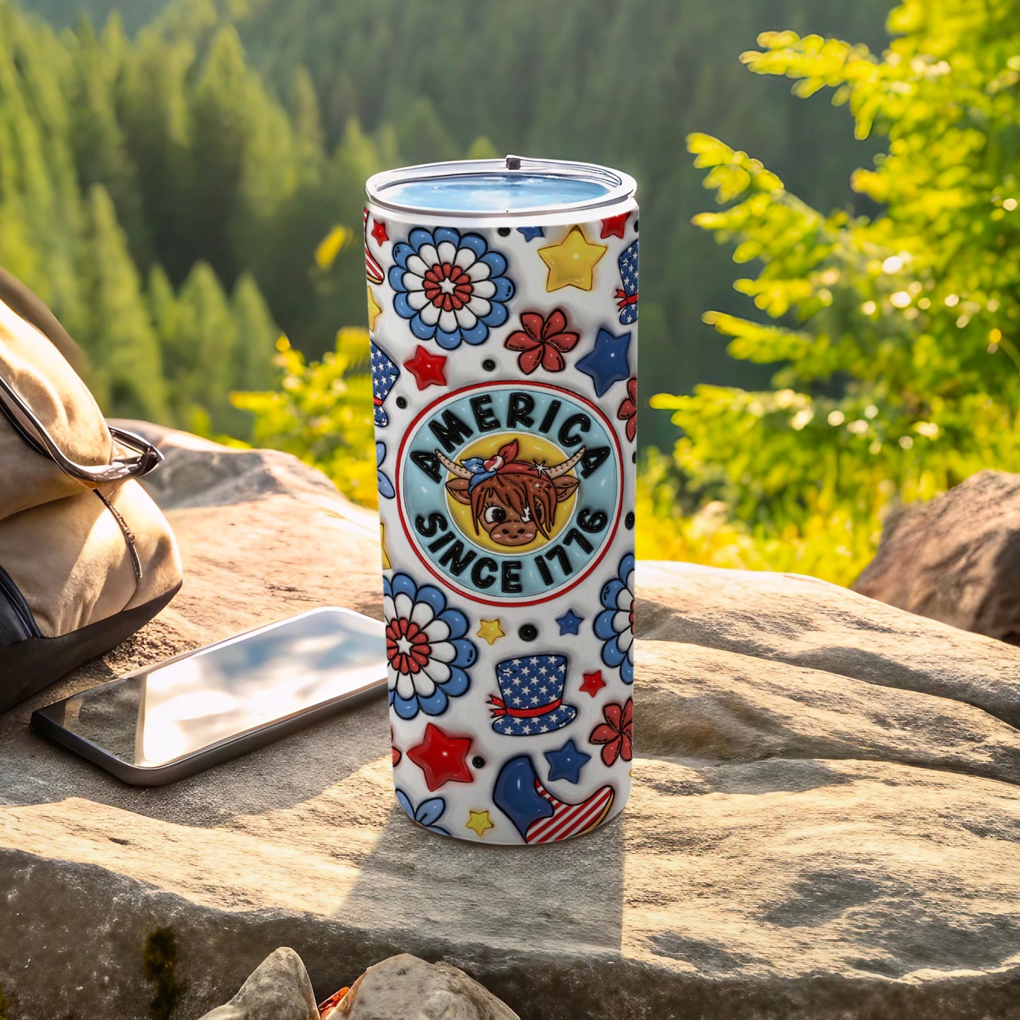Patriotic tumbler with stars, flowers, and "America Since 1776" text.