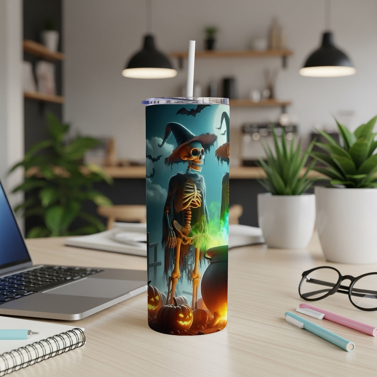 Halloween tumbler with skeleton, witch hat, cauldron, pumpkins, and bats.