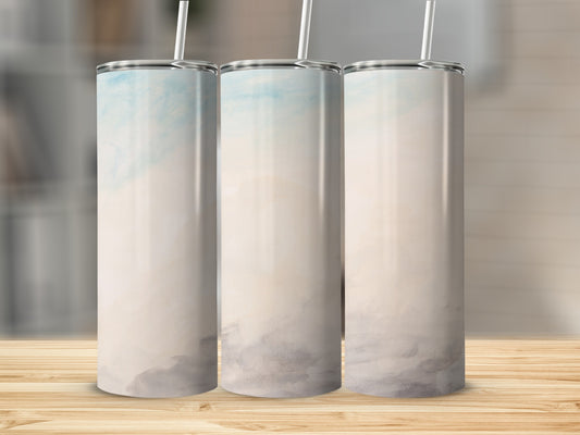 Three tall, slim tumblers with a watercolor sky design.
