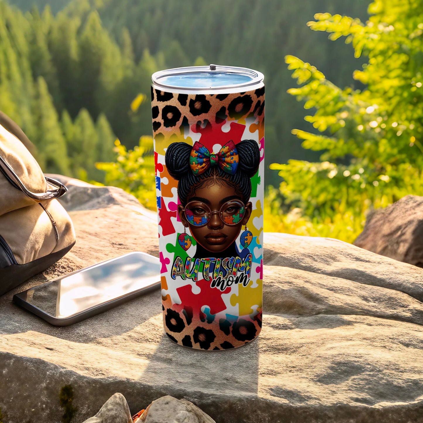 Autism Mom tumbler with puzzle pieces, leopard print, and colorful bow.