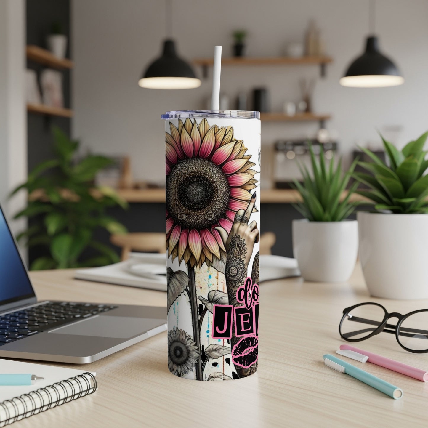 Tall tumbler with a sunflower, peace sign hand, and "do good" text.