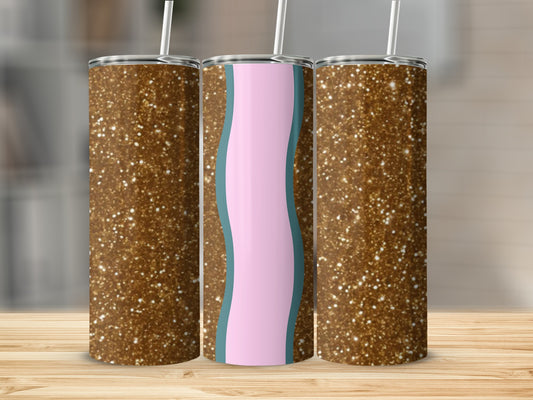 Three glitter-covered tumblers with straws, one with pink and blue wave design.