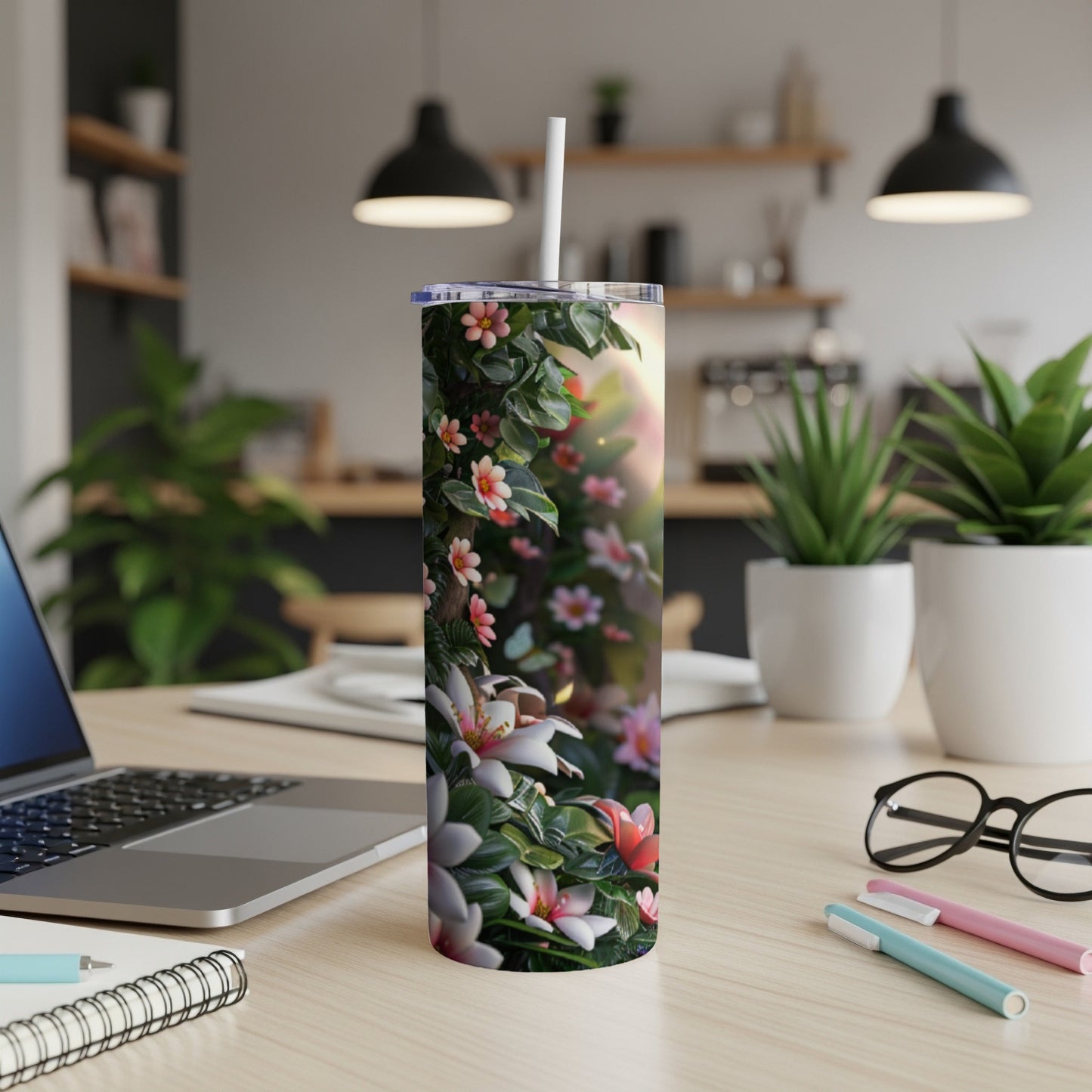 Tumbler with a floral design featuring lilies and small pink flowers.