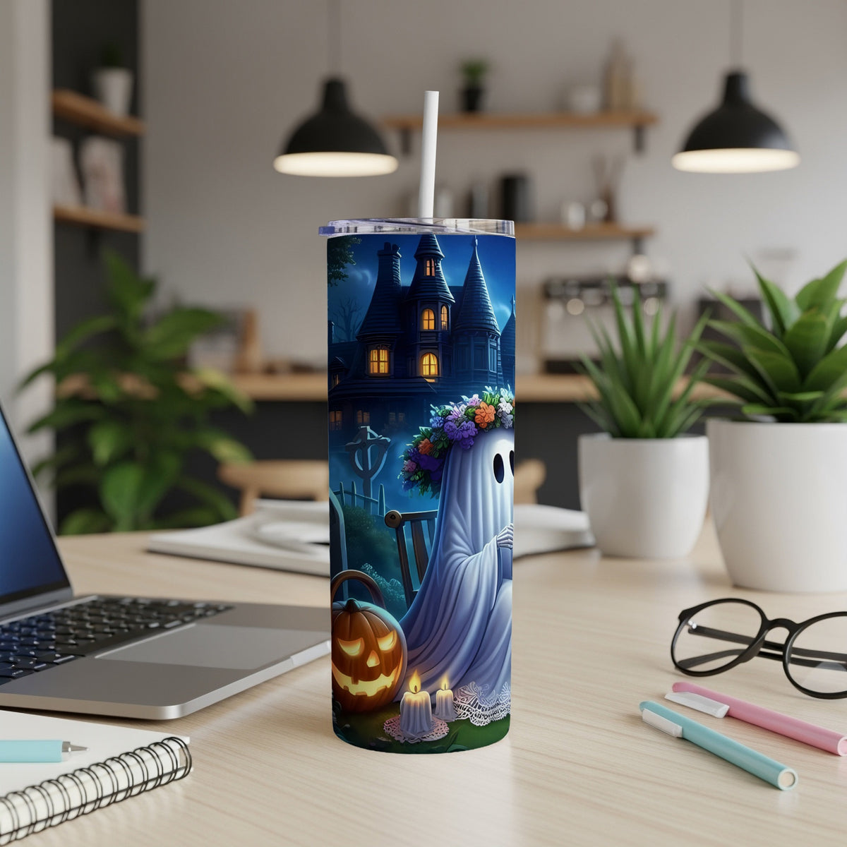 Tumbler with ghost, pumpkin, candles, and spooky house Halloween design.