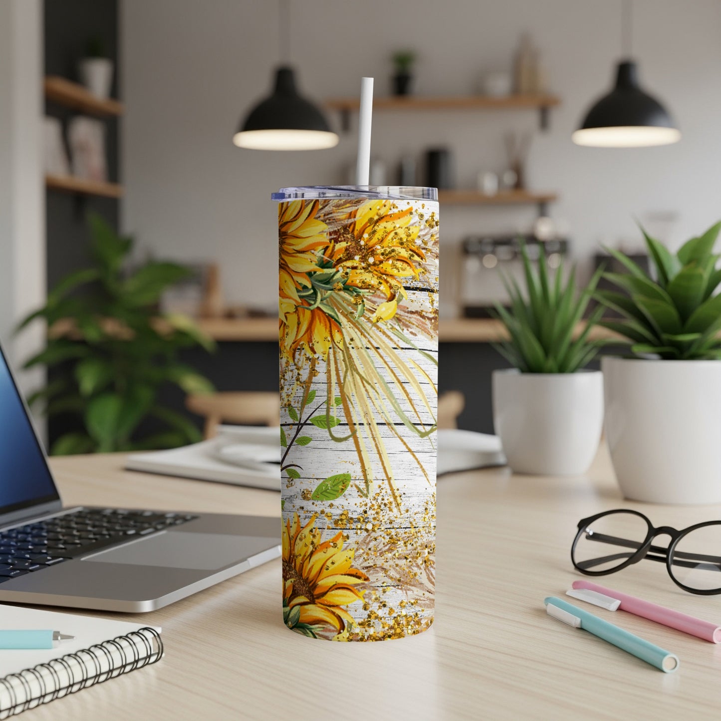 Tall tumbler with sunflowers and wood grain pattern, straw in lid.