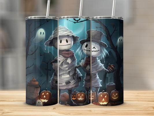 Halloween tumbler with mummy and skeleton characters, pumpkins, and ghosts.
