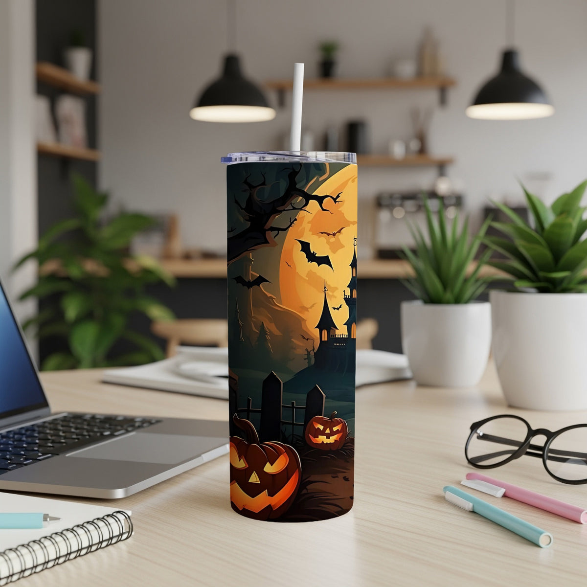 Tumbler with Halloween scene featuring pumpkins, bats, and a spooky castle under a full moon.