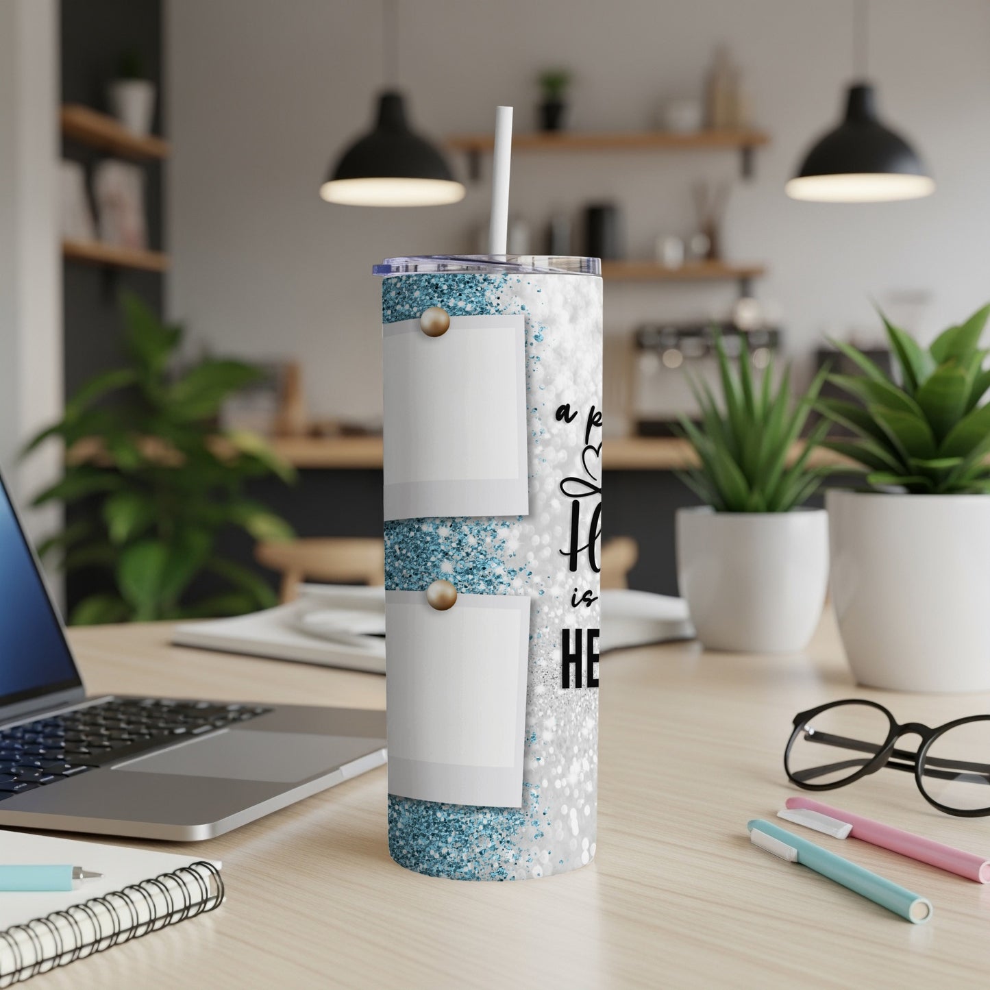 Glittery tumbler with two photo frames and text "a home is"