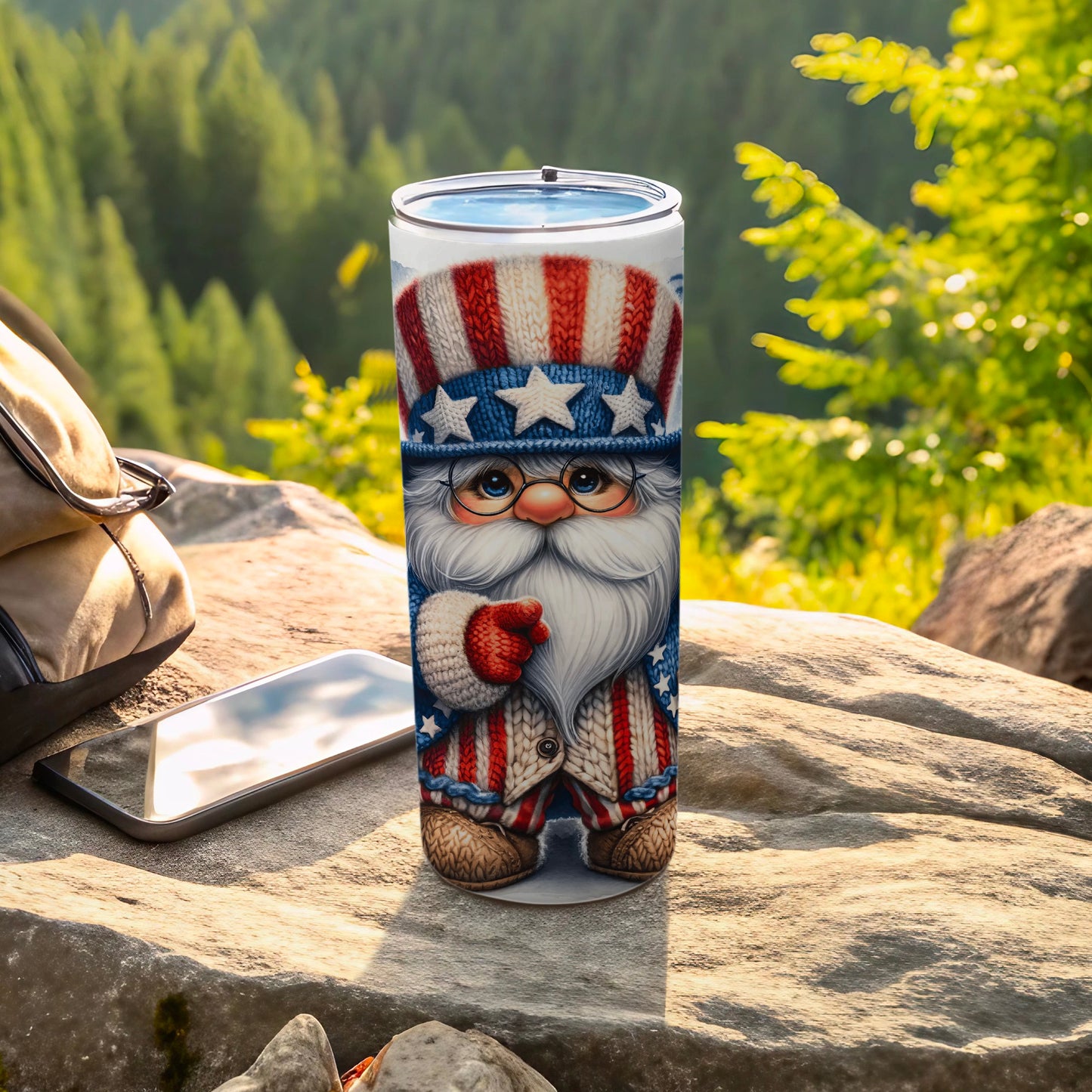 Patriotic Santa Claus tumbler with stars and stripes, on a rock outdoors.