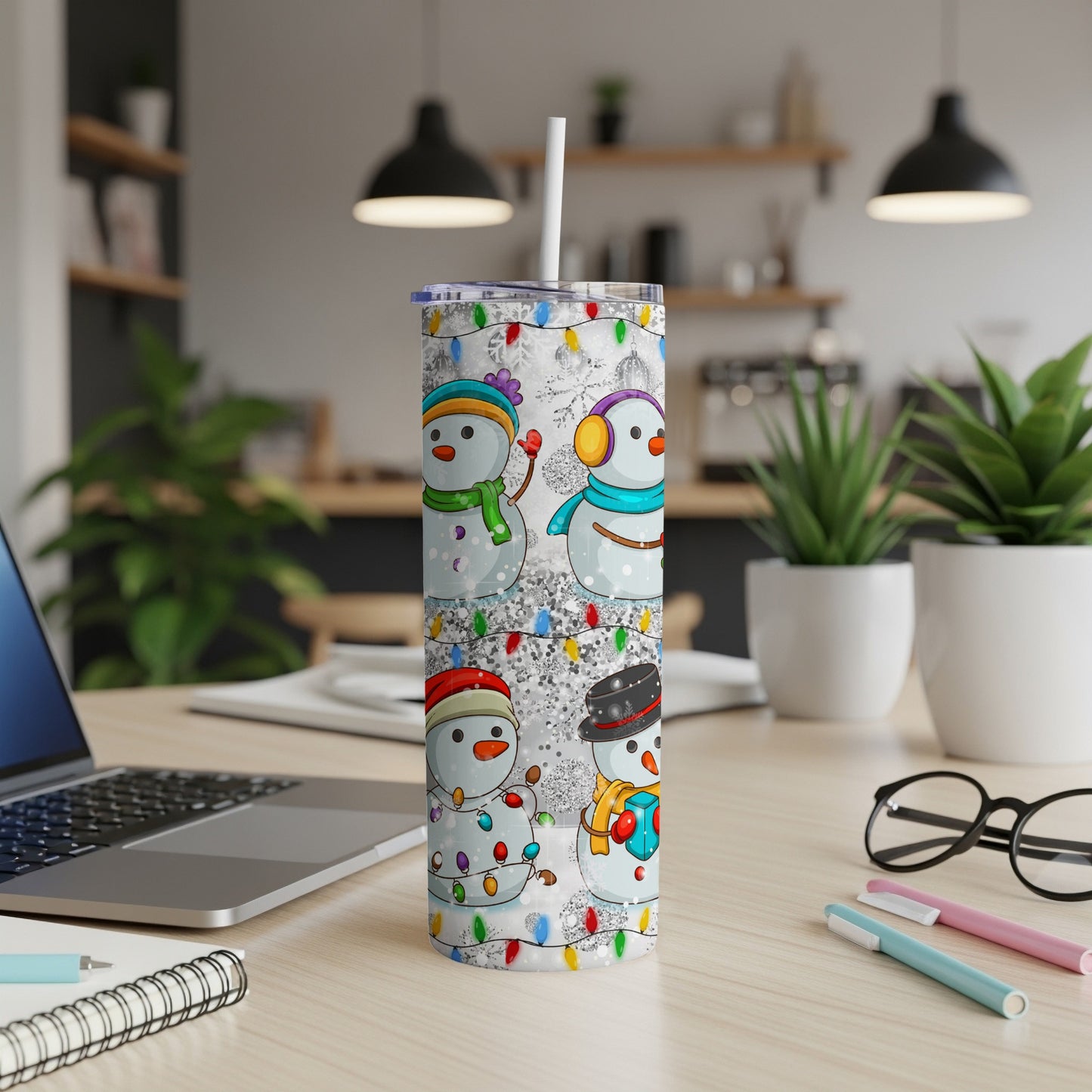 Snowman tumbler with colorful lights and festive accessories.