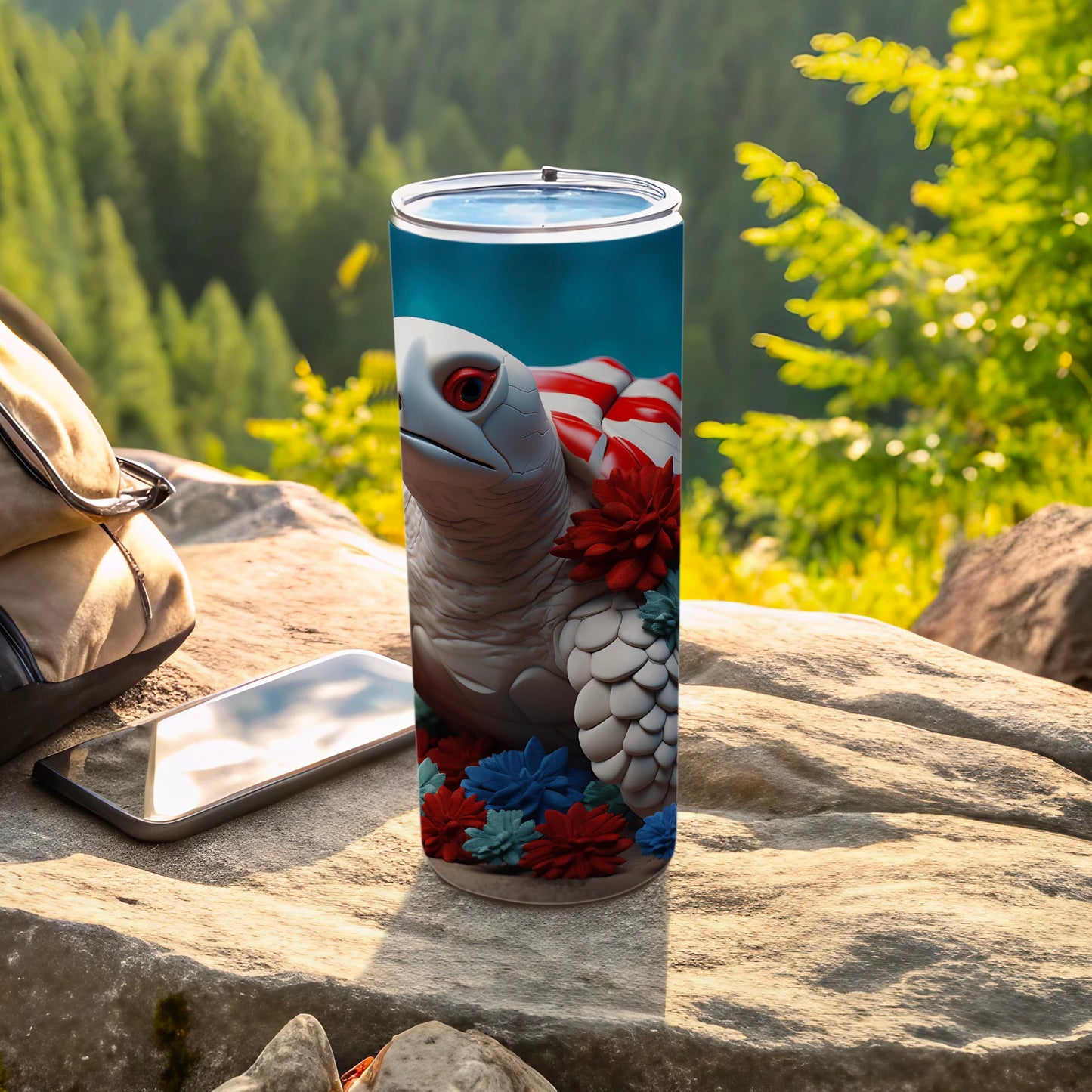 Turtle tumbler with American flag and floral accents on rocks.